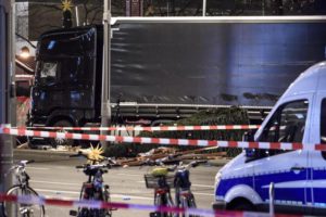 epa05682928 A knocked over christmas tree lies on the floor in front of a truck at the scene where a truck crashed into a Christmas market, close to the Kaiser Wilhelm memorial church in Berlin, Germany, 19 December 2016. According to the police, at least 12 people are reported killed and at least 48 injured in what police suspect was a deliberate attack. EPA/CLEMENS BILAN ATTENTION EDITORS : MANDATORY CREDIT - CLEMENS BILAN/EPA